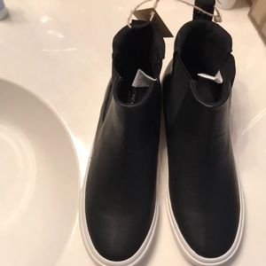 black pleather high tops